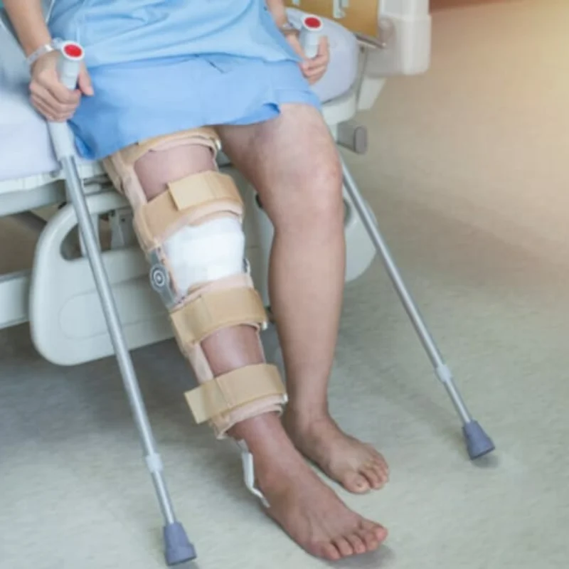 Physiotherapist assisting a patient with leg rehabilitation